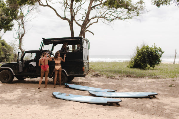 Two girls getting ready for a surf lesson at Peanut Farm in Sri Lanka
